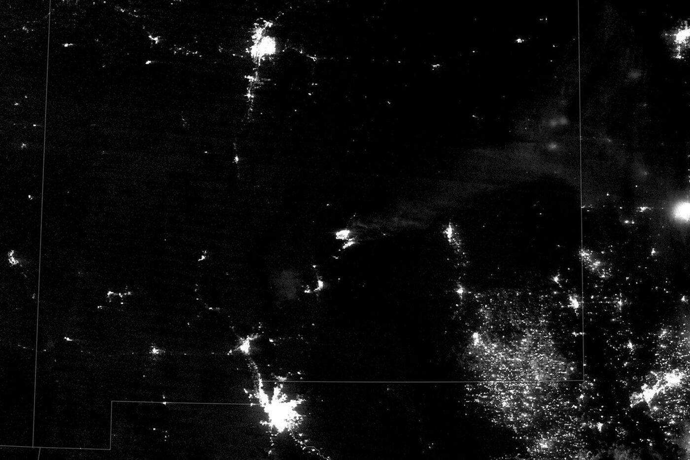 Nighttime satellite view of the South Fork and Salt fires and surrounding New Mexico communities.